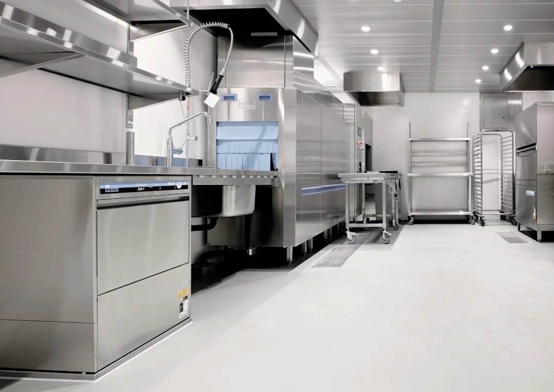 Cleaner cleaning the floor in a laboratory environment